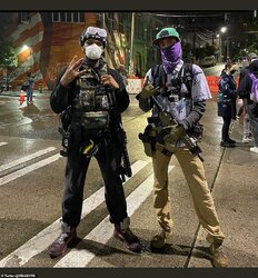 30227162-8475061-Demonstrators_have_occupied_several_blocks_around_the_Seattle_Po-a-72_1593564...jpg