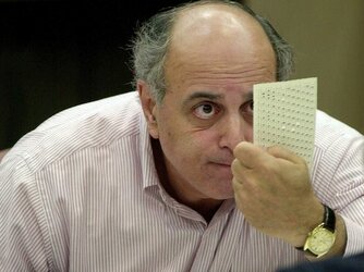 broward-county-canvassing-board-member-judge-robert-rosenberg-looks-over-a-questionable-ballot...jpg