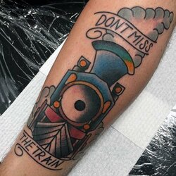 color-abstract-mens-train-tattoo-on-forearm.jpg