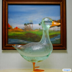 a-transparent-sculpture-of-a-duck-made-out-of-glass.jpg