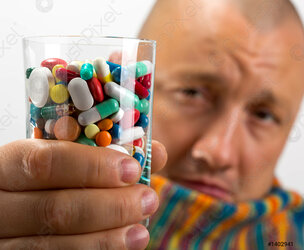 man-drinking-pills-1402941.jpg