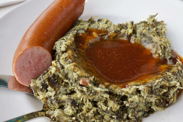 the-best-dutch-food-savoury-recipes-dutch-boerenkool-stamppot-on-a-white-plate-traditional-dut...jpg