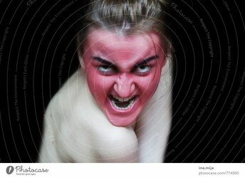 714560-angry-creepy-red-painted-face-feasts-and-celebrations-photocase-stock-photo-large.jpeg