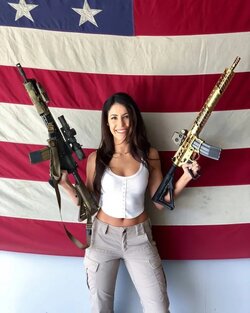 Anna-Paulina-with-guns-flag-backdop.jpg