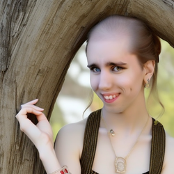00414-2402390826-portrait shot of (cyraxx_1.0) as beautiful woman in a dress and makeup and pr...png