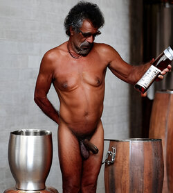 naked-australian-aboriginal-man-is-drinking-alcohol-from-the-silver-bladder-of-cask-wine_IBqHj...jpg