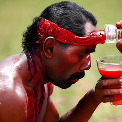 australian-aboriginal-man-drinking-the-blood-of-youths_3qHsUFMr_upscaled.jpg