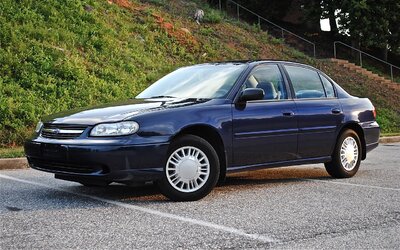 Chevroletmalibusedaninnavybluewithsteelwheelsandhubcaps.jpg