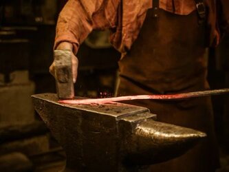 depositphotos_133495728-stock-photo-senior-blacksmith-forging-the-molten.jpg