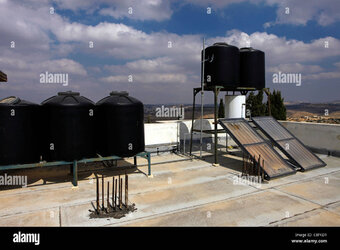 plastic-drinking-water-tanks-containers-on-a-roof-in-a-palestinian-C8FKD1.jpg
