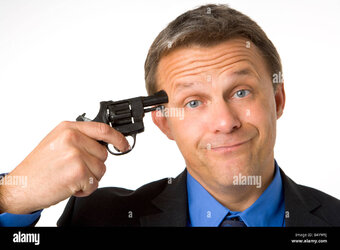 businessman-holding-gun-to-head-B4YW9J.jpg