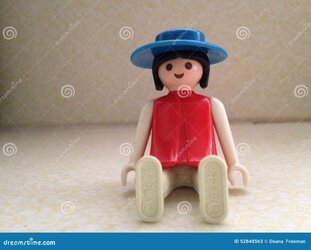 vintage-toy-playmobil-doll-sitting-52848563.jpg