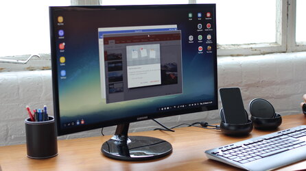 Samsung_DeX_dock_with_S8,_plugged_into_monitor.jpg