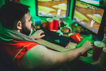 gamer-playing-video-games-picture-id1203579294-26690428.jpg