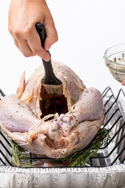 5D4B4073-Grilled-Turkey-w-Rosemary-butter-rosemary-butter-spread-inside-of-raw-turkey-1200x1800.jpg