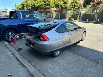 I couldnt own a small car. You cant even fit a bike in them..jpg