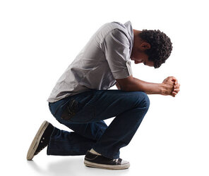 young-man-praying-on-his-knees-picture-id185058315-968947321.jpeg