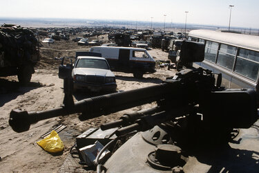 Highway_of_Death,_DShKM_or_Type_54_HMG_mounted_on_top_of_a_turret_of_a_tank.jpg