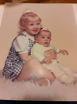 unfortunate baby picture with sister.jpg