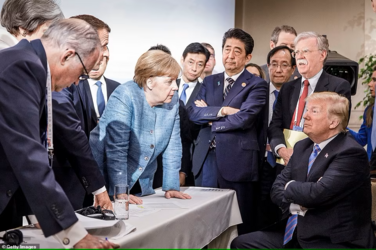 60026515-10994501-German_Chancellor_Angela_Merkel_deliberates_with_US_president_Do-a-11_165727...png