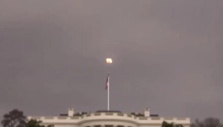small_explosion_in_the_middle_of_the_sky_very_high_above_white_house__shaky__blurry_photo_of_t...jpg