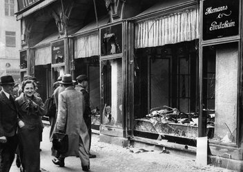 damaged-jewish-owned-storefront-after-kristallnacht-riot.jpg
