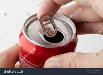 stock-photo-batumi-georgia-close-up-of-a-man-s-hand-opening-a-coca-cola-can-on-a-white-backgro...jpg