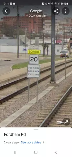 Train tracks with school zone speed limit ️.jpeg