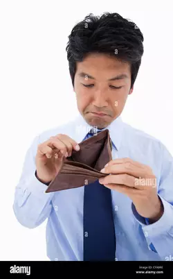 portrait-of-a-sad-businessman-showing-his-empty-wallet-CFA0RE.jpg