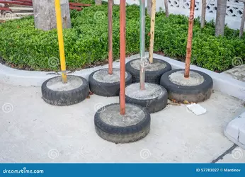 parking-blockage-device-made-old-tire-concrete-57783027.webp