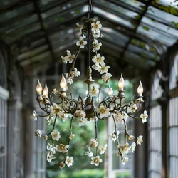 ornate-chandelier-with-delicate-floral-accents-hanging-glasscovered-structure_885831-38279.jpg