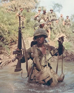 USSoliderInCreekVietnam.jpg