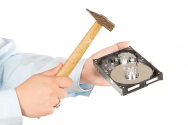 breaking-hard-disk-drive-with-hammer-isolated-white_136401-1033.jpg