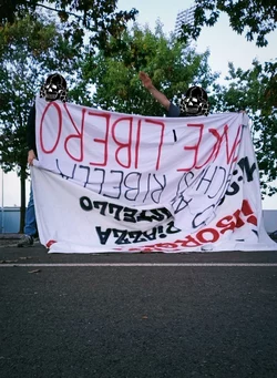 Young militants of Rete Studentesca remove anti-fascist posters and banners in front of the Fo...jpg