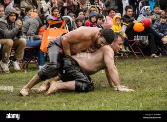 turkish-oil-wrestlerswrestling-during-the-turkish-festival-in-london-H99HJG.jpg