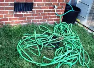 Omaha-garden-hoses-tangled-together-300x219.webp