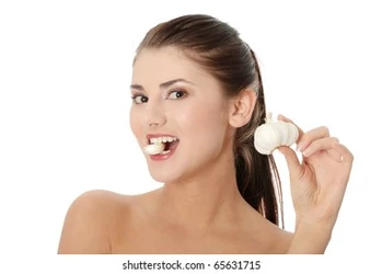 young-beautiful-woman-eating-garlic-260nw-65631715.jpg
