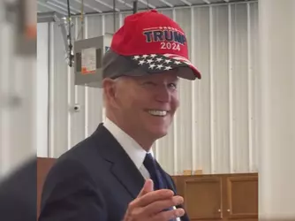 75193819007-trnd-biden-puts-on-trump-hat-thumb.webp