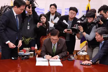 20241214_ROK_NA_Speaker_Woo_Won_Shik_signing_the_resolution_to_impeach_President_Yoon_Suk_Yeo...webp