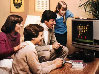 family-playing-atari-on-a-tv.webp