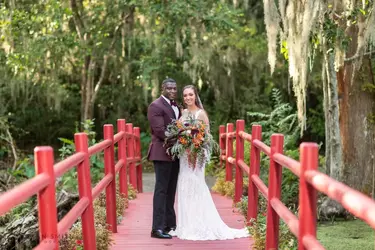 portraits-of-bride-and-groom-on-the-red-bridge-magnolia-plantation-charleston-sc-2020-4-1500x...webp