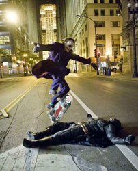 Joker-Heath-Ledger-Skating-Over-Batman-Christian-Bale-Picture.jpg